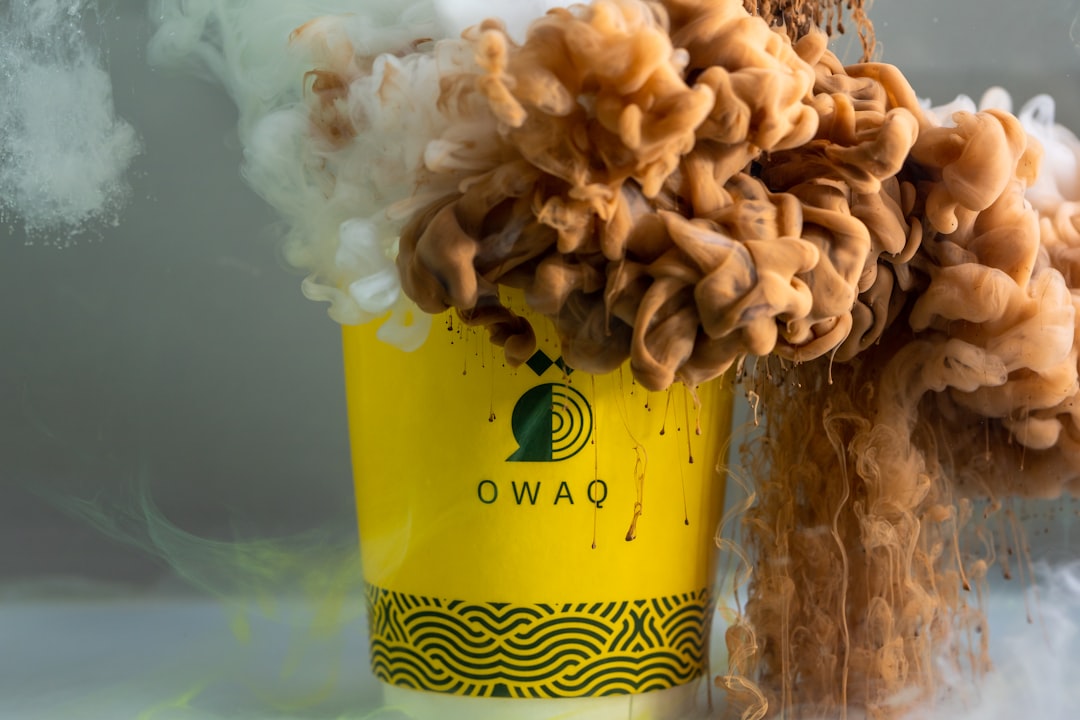 I used white and brown ink to create the effect of coffee and its explosion in the mug